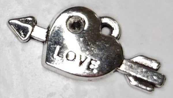 Arrow through a heart (Love engraved)