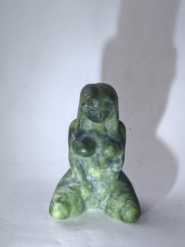Serpentine kneeling woman