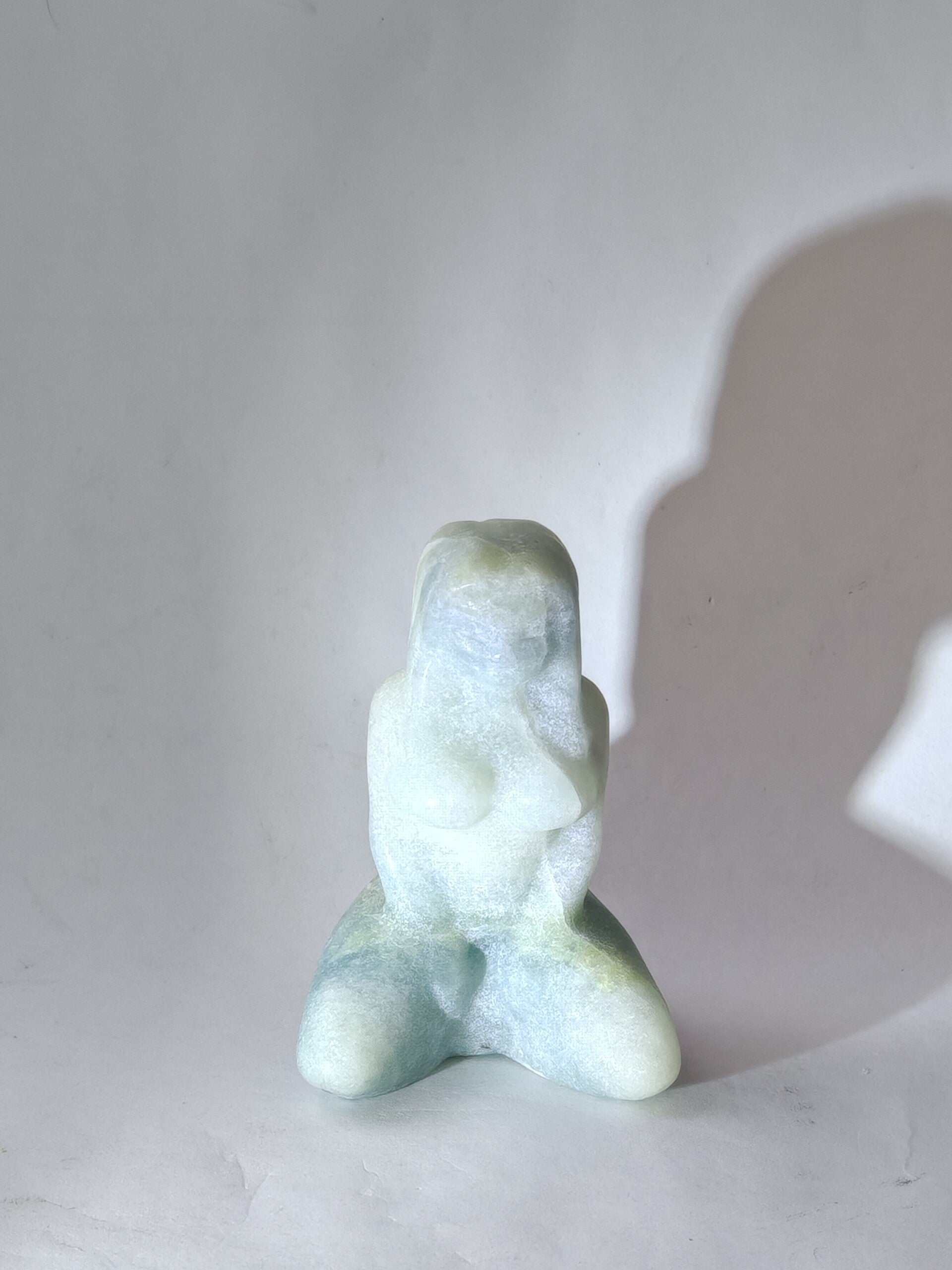 Blue Jade kneeling woman