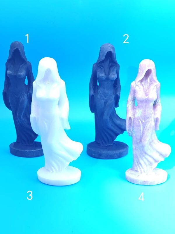 Cloaked woman crystal carving