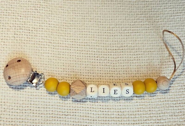 Speenkoord met naam - okergeel