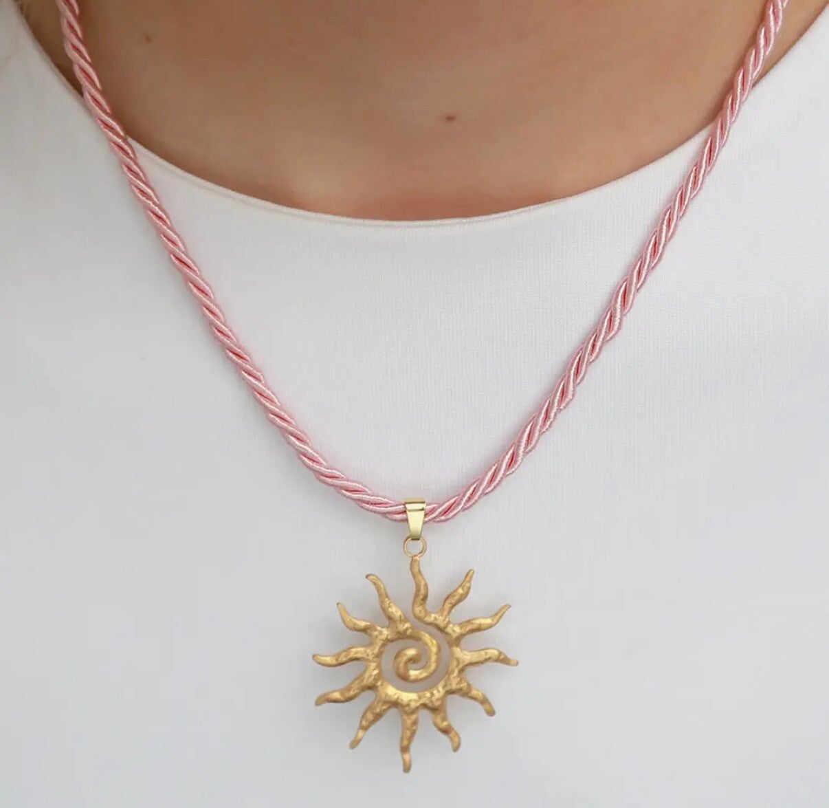 Verklaring ketting met zon roze