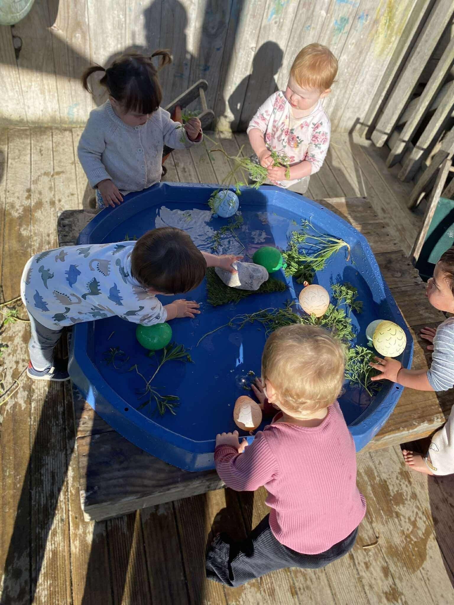 Babies exploring a play-based learning environment at KCC Howick