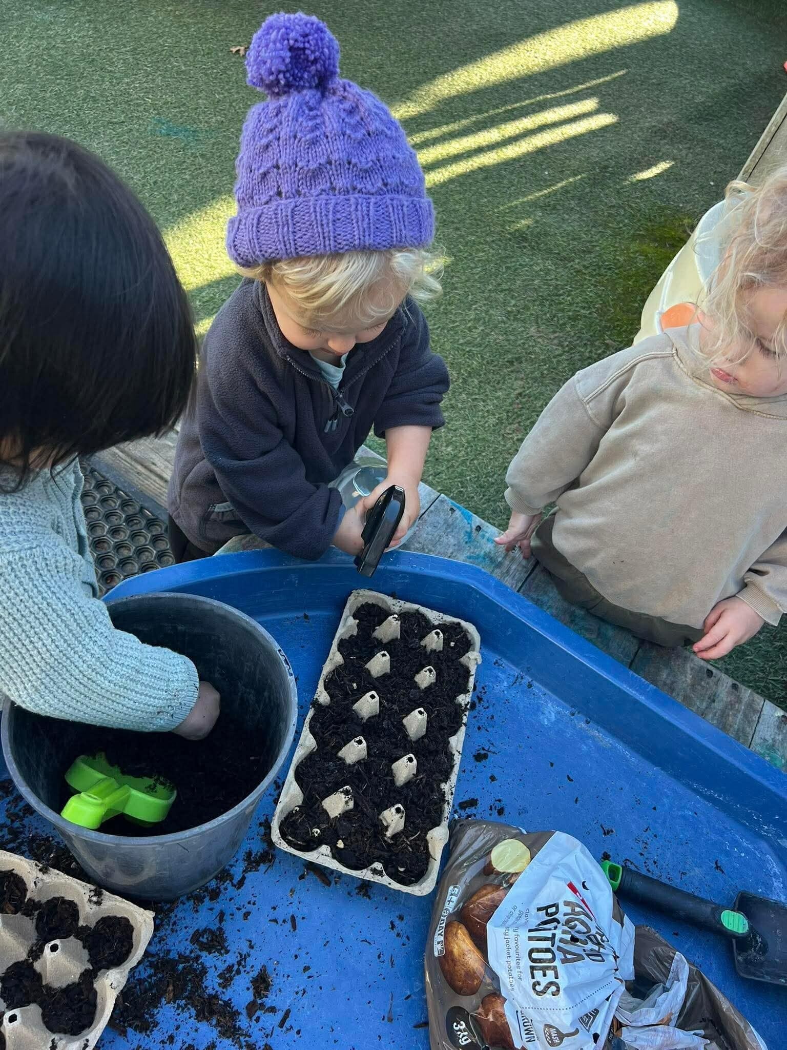 Children gardening and learning about nature at KCC in Howick