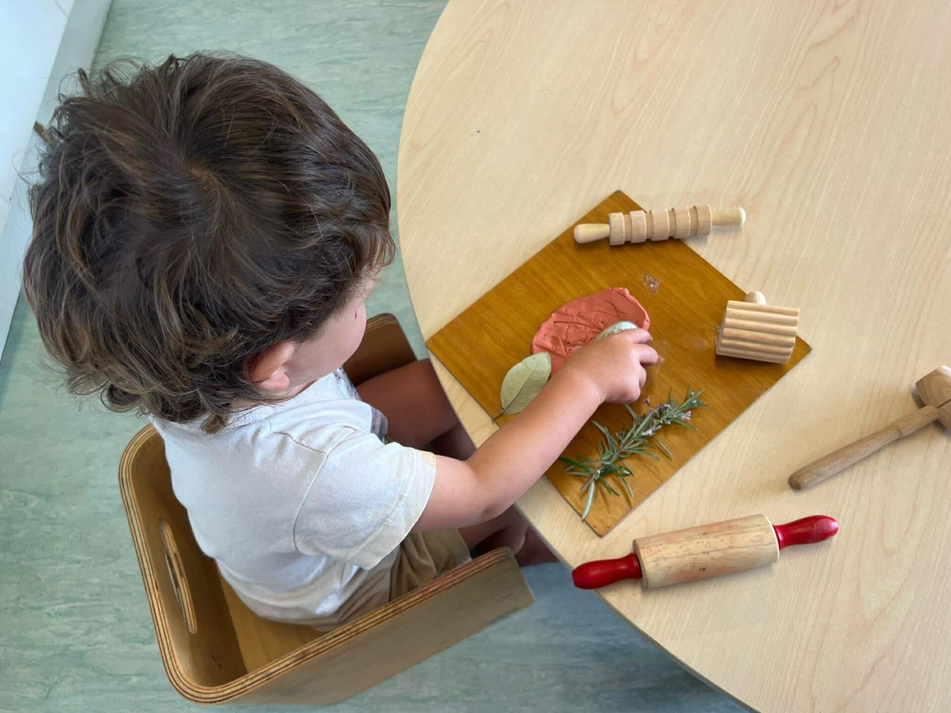 Babies exploring a play-based learning environment at KCC Howick