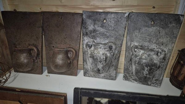 Stenen schilderijtjes met halve pot