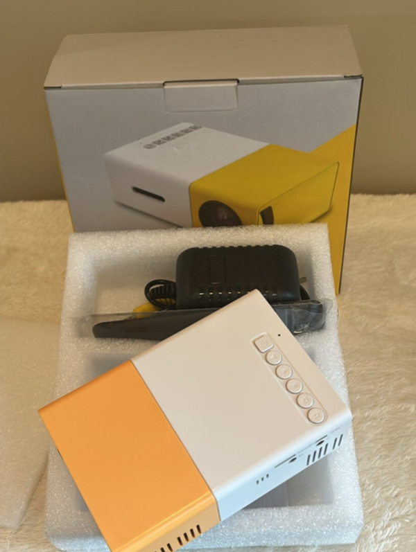 M42.  YG300 Mini LED Projector Upgraded Version Supported 1080P