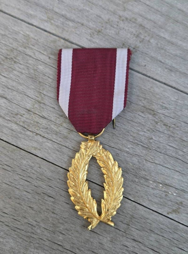 Gouden Palmen in de Kroonorde van België.