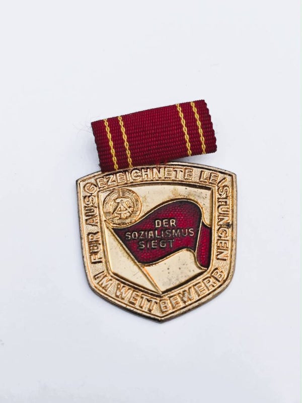 Medaille für ausgezeichnete Leistungen im Wettbewerb.