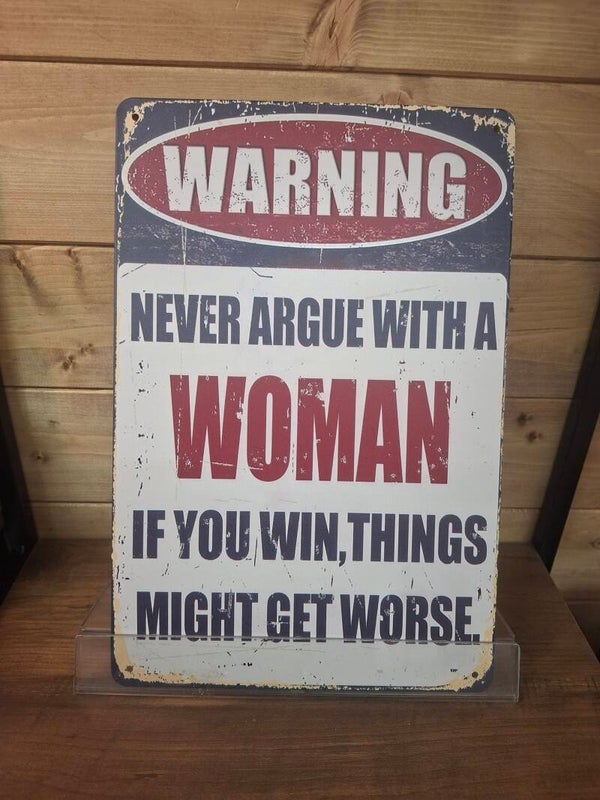 Warning, never argue with a women sign