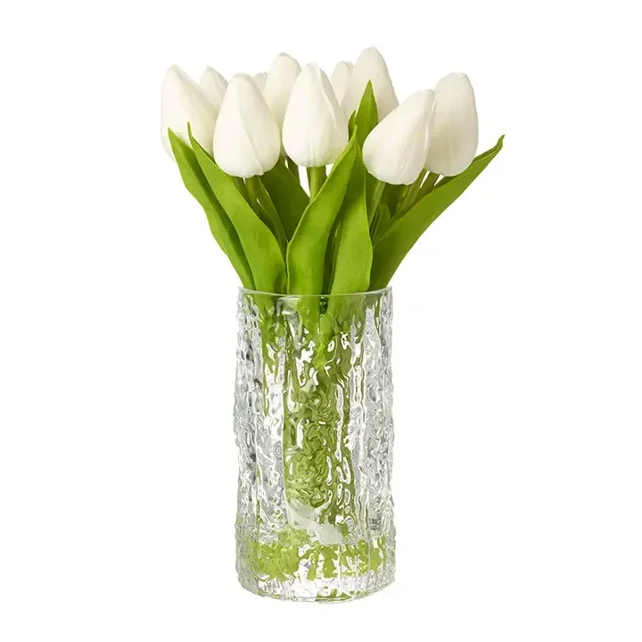 White Closed Tulips Stems in Glass Vase