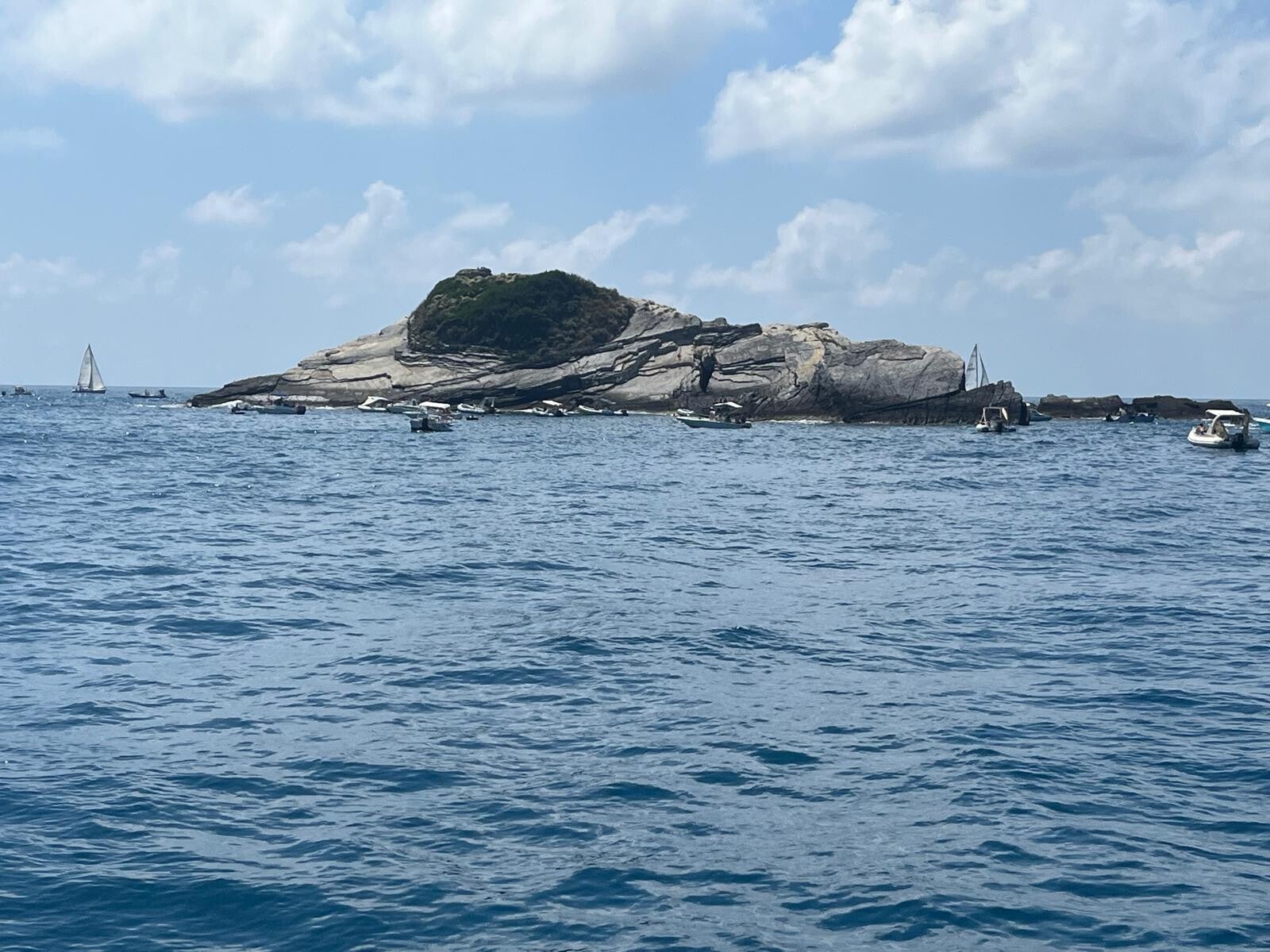 A beautiful sailboat cruising the Mediterranean Sea, showcasing the Cinque Terre and Gulf of Poets boat trips organized near the property