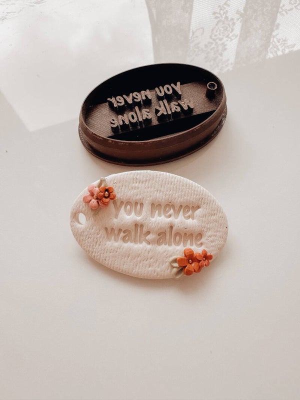 cutter keychain 'you never walk alone'