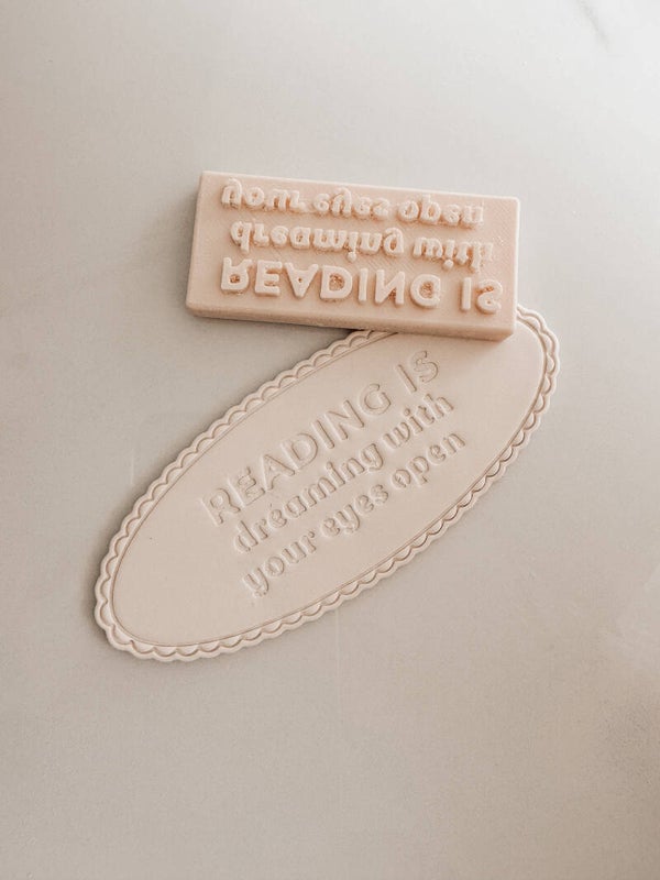 Stamp bookmark ‘reading is dreaming’