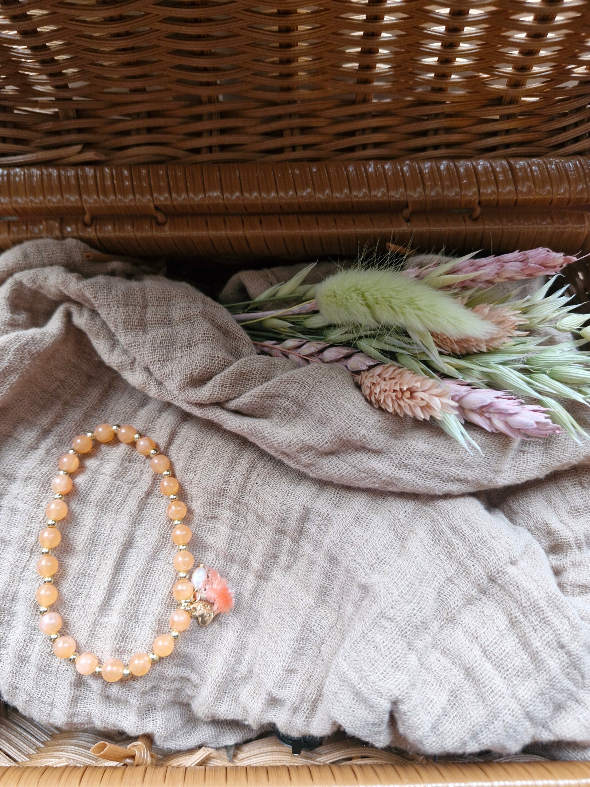 Armbandje pastel oranje