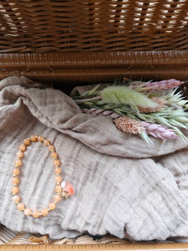 Armbandje pastel oranje