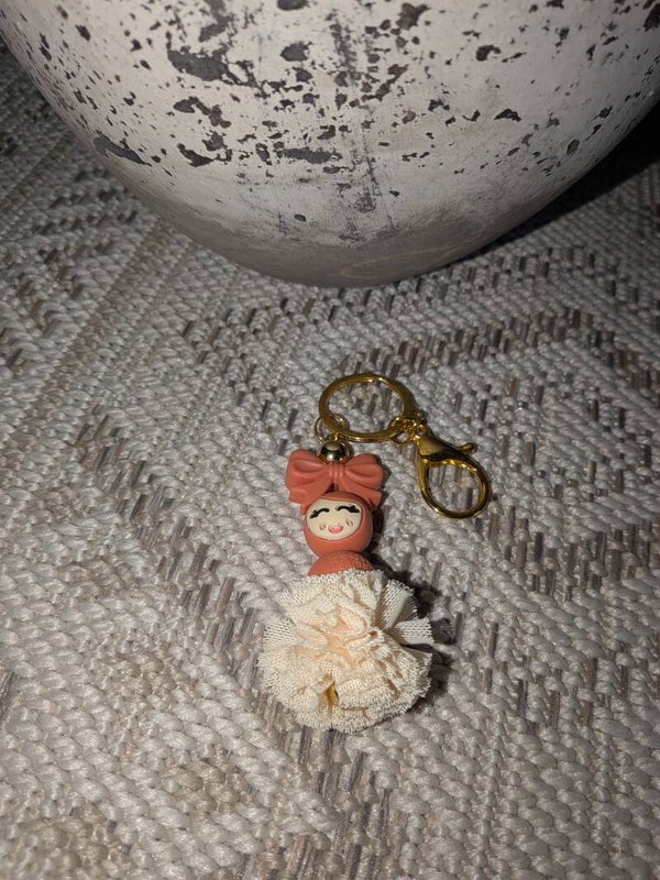 Sleutelhanger met cream pompon popje van geluk