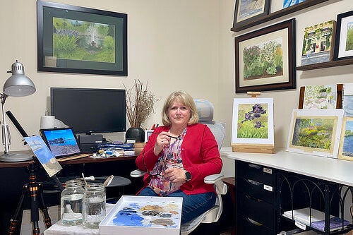 Image of Sylvia McConnell sitting in her studio
