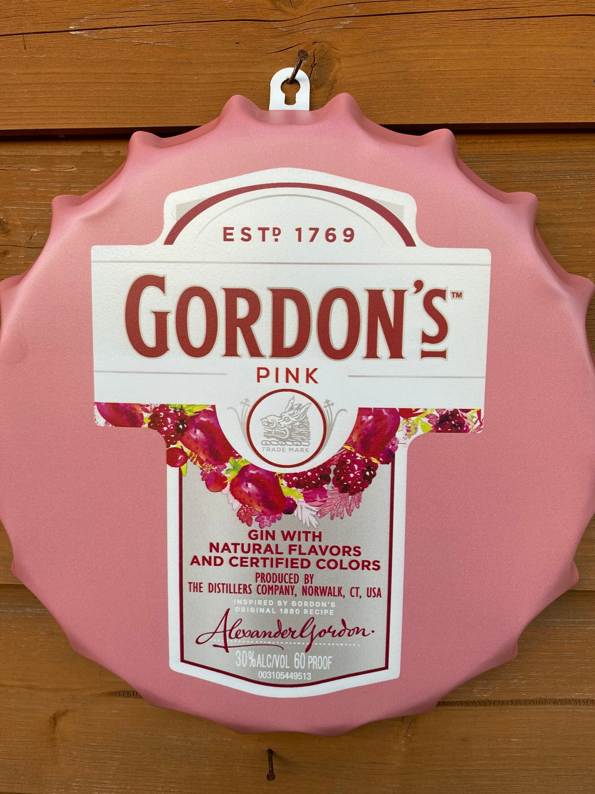 Gordon’s pink gin metal wall cap
