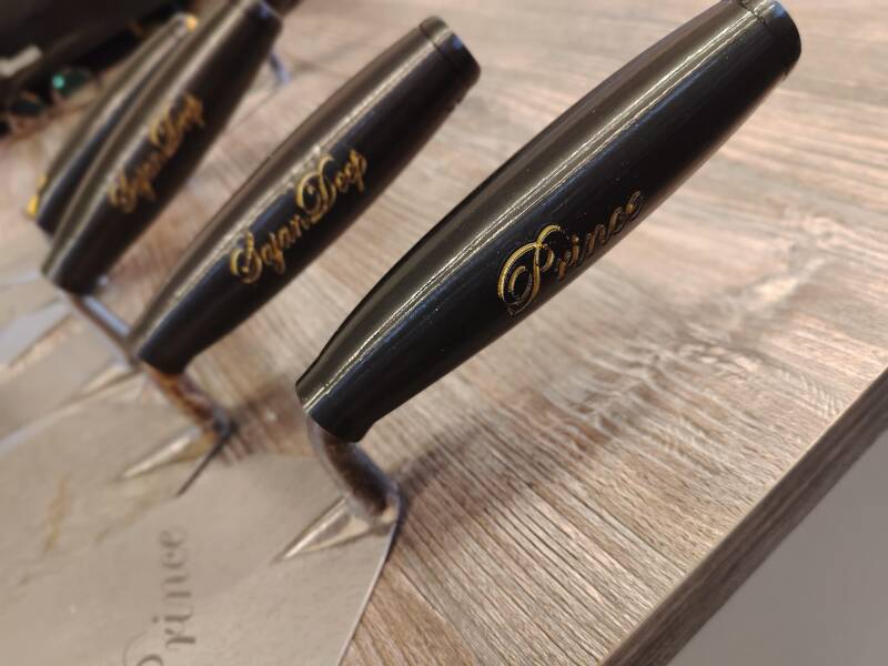 Black handles with gold personalised lettering