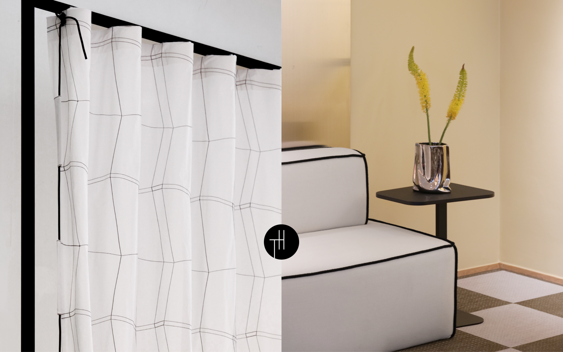 White curtains with fine black lines beside a white sofa with black piping, showing the role of contrast in interior trends 2028.
