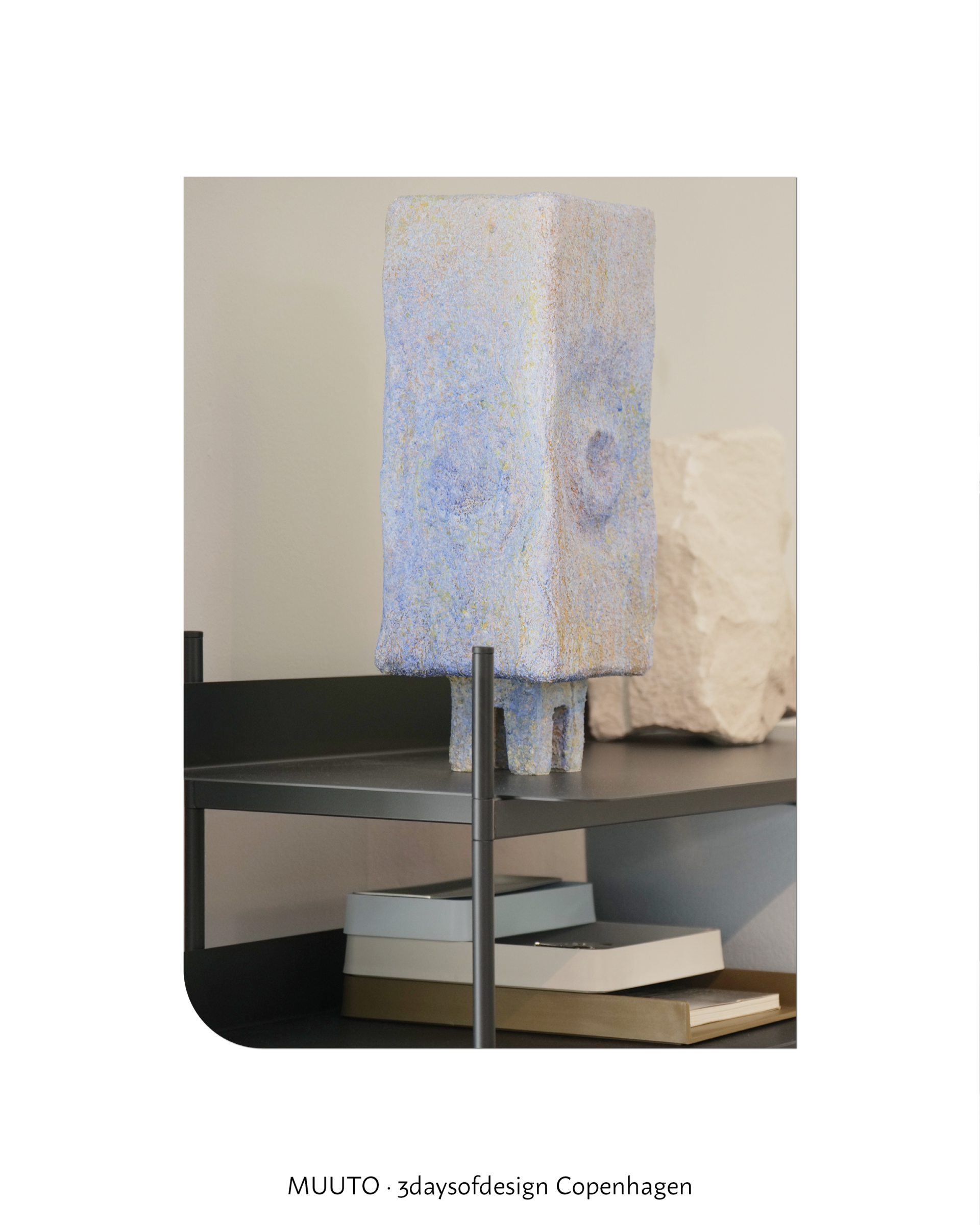Muuto interior object on a black table, showing black as structure and contrast within a calm home decor setting.