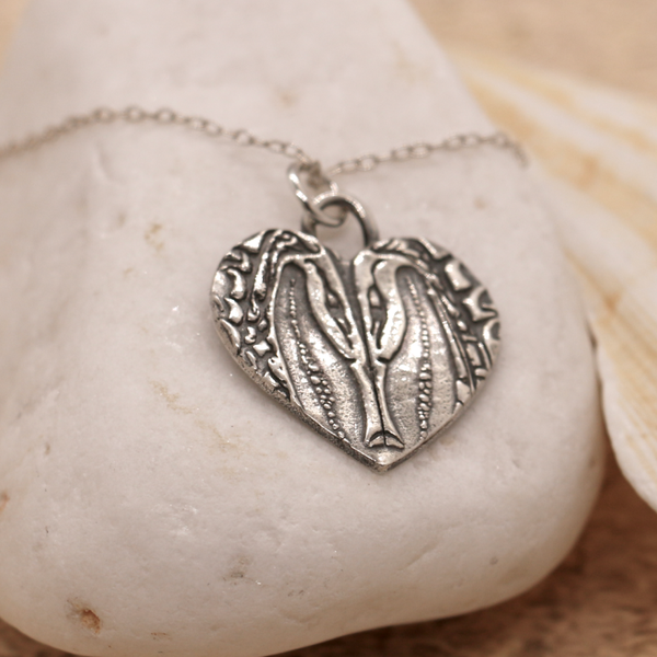 Silver seahorses heart necklace