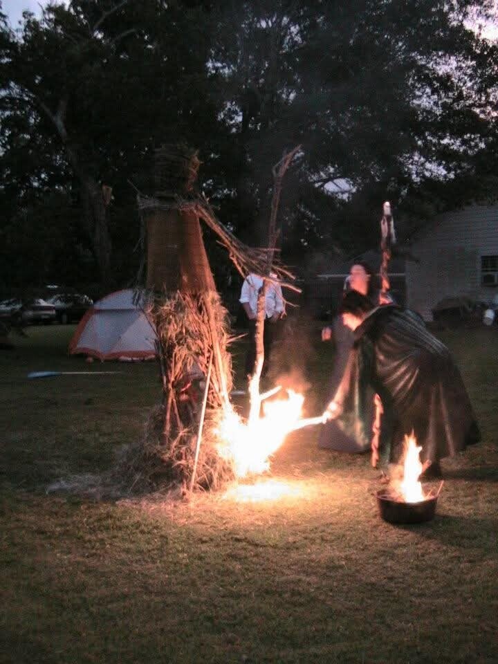 Fellow Witch, Lady Autumn Hawk touching fire to the Wickerman.