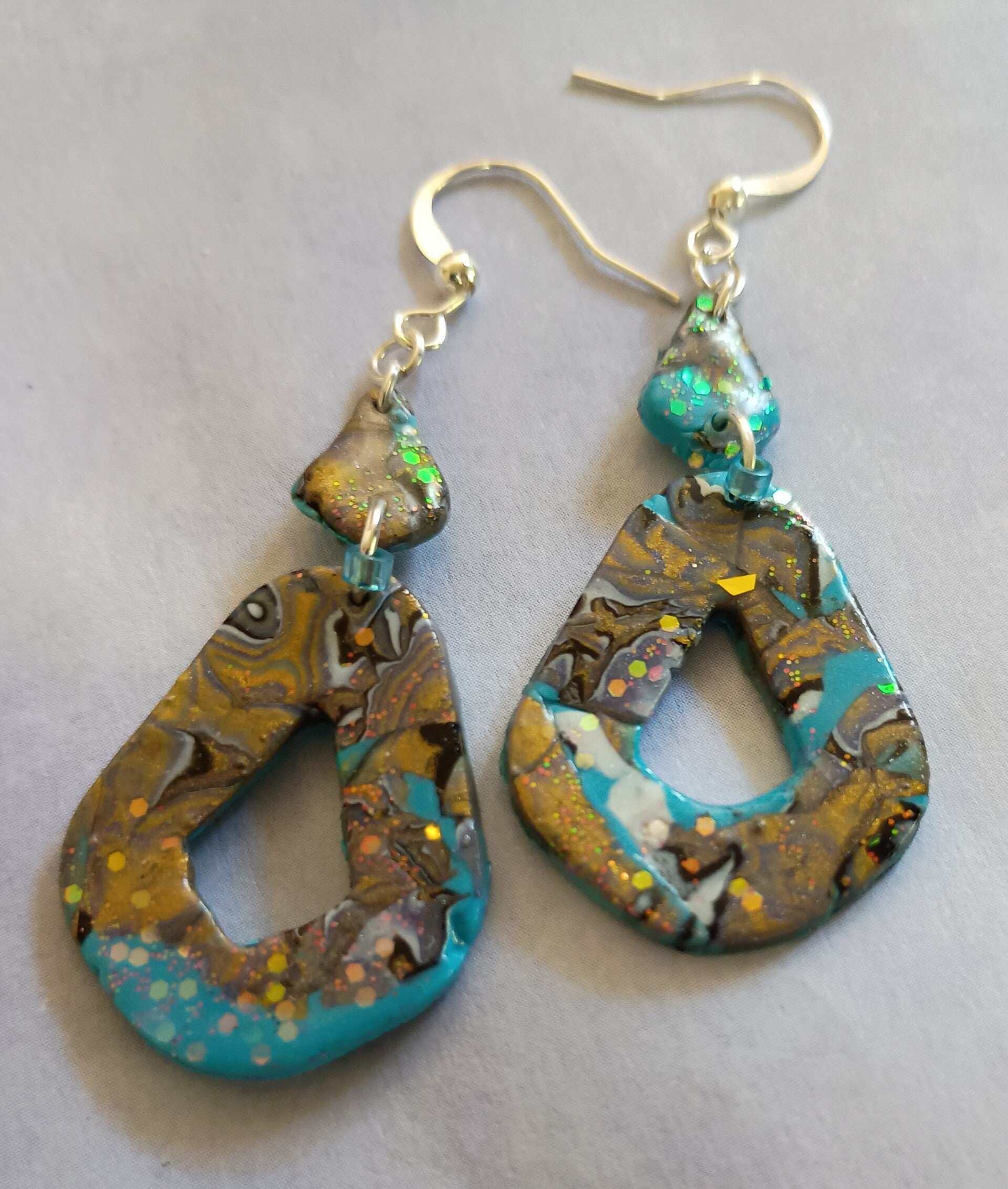 Gilded Lagoon Mokume Diamond Drop Earrings.