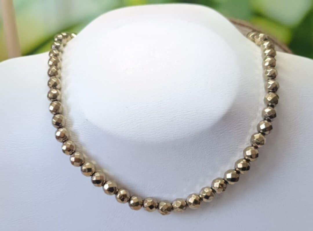Collier Hématite Doré 8mm Facetté