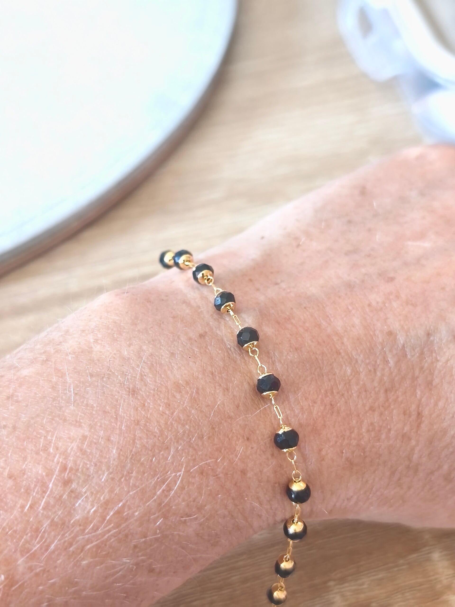 Perles dorées et noires