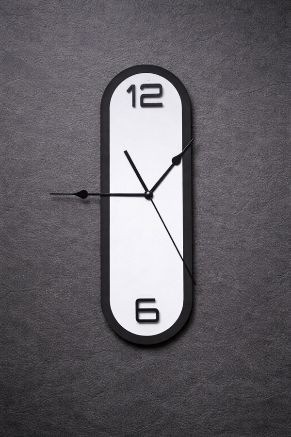 Shop this modern geometric wooden wall clock featuring a stylish black and white layered design. Perfect for living rooms, studies and home offices.