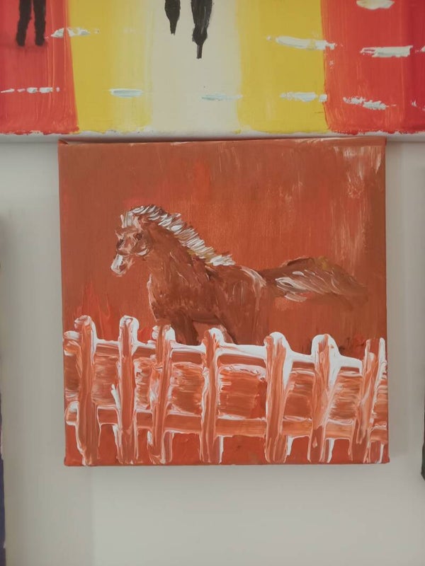 Horse behind the fence