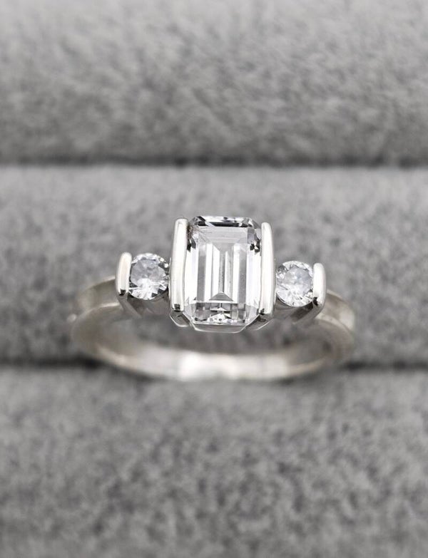 Emerald cut triple stone