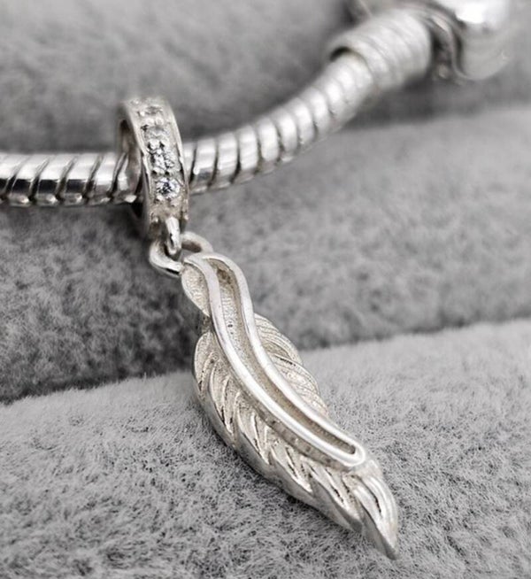 Feather dangle charm