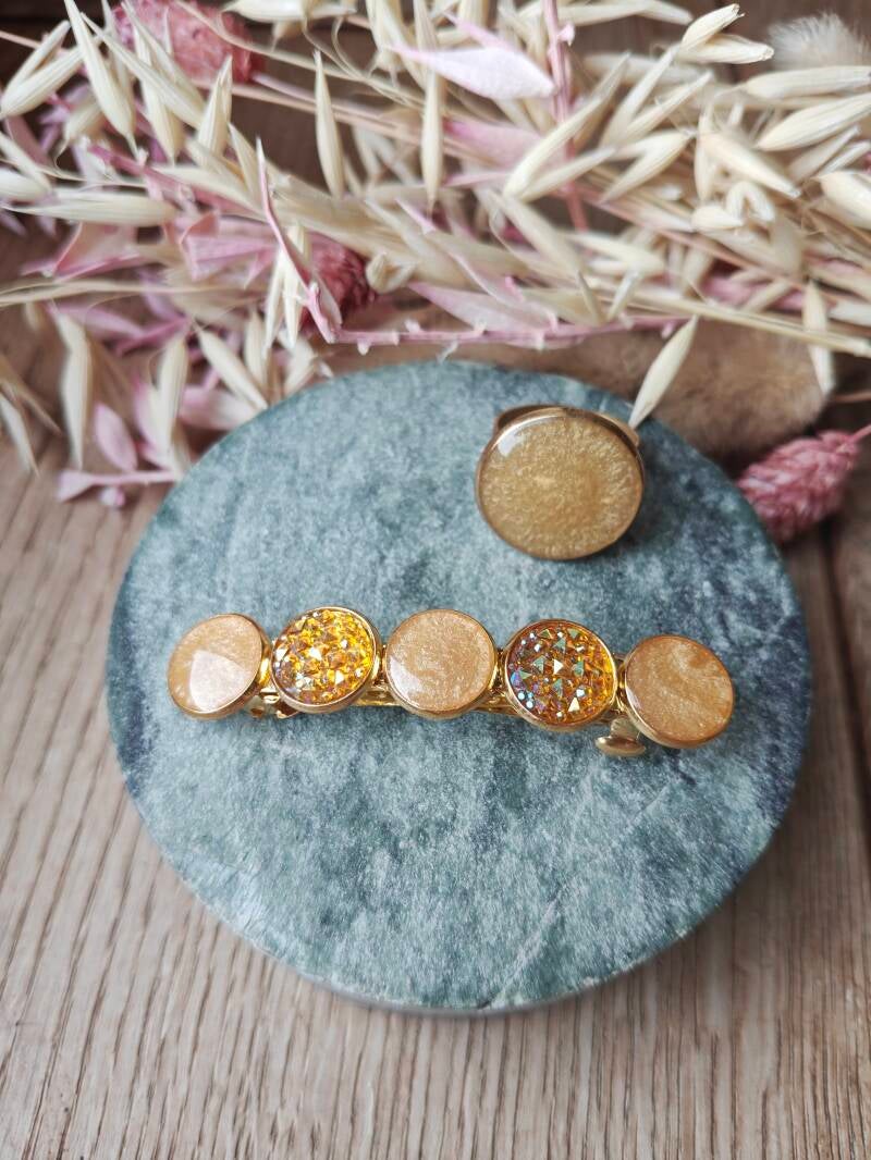 Juwelenset: oranje ring en haarspeld