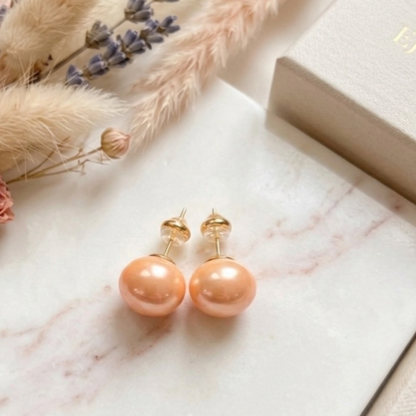 Oorbel KLEIN 62: studoorbel pastel oranje