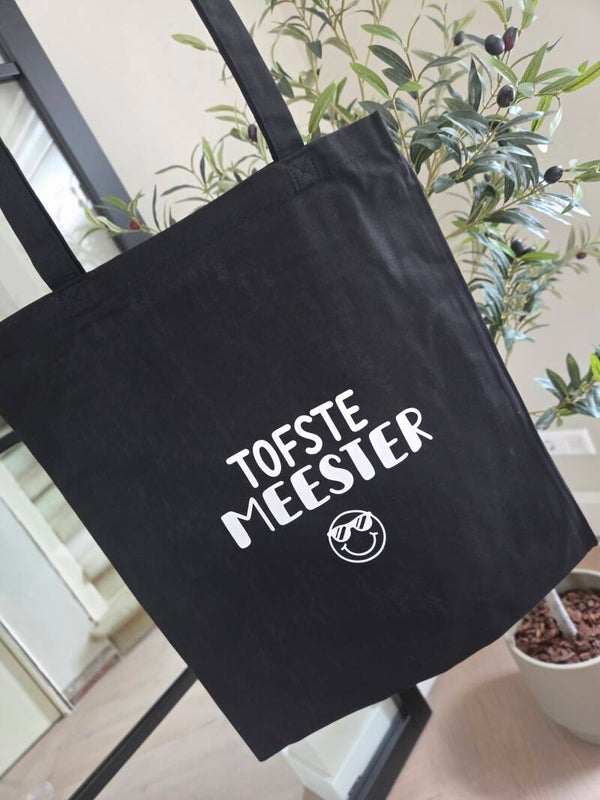 Zwarte Canvastas “Tofste Meester” – Hip Cadeau voor het Einde van het Schooljaar