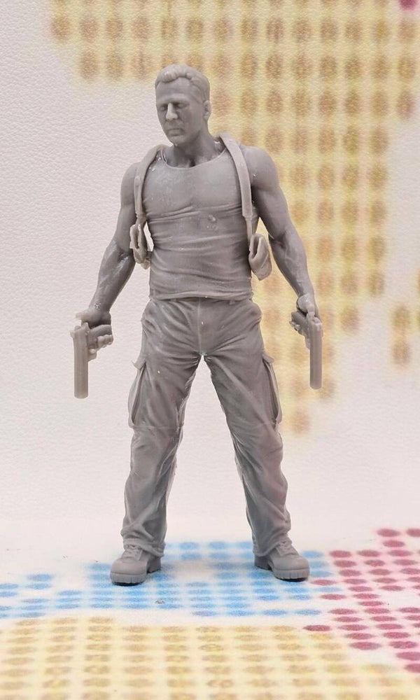 Bruce Willis as John McClane in DIE HARD