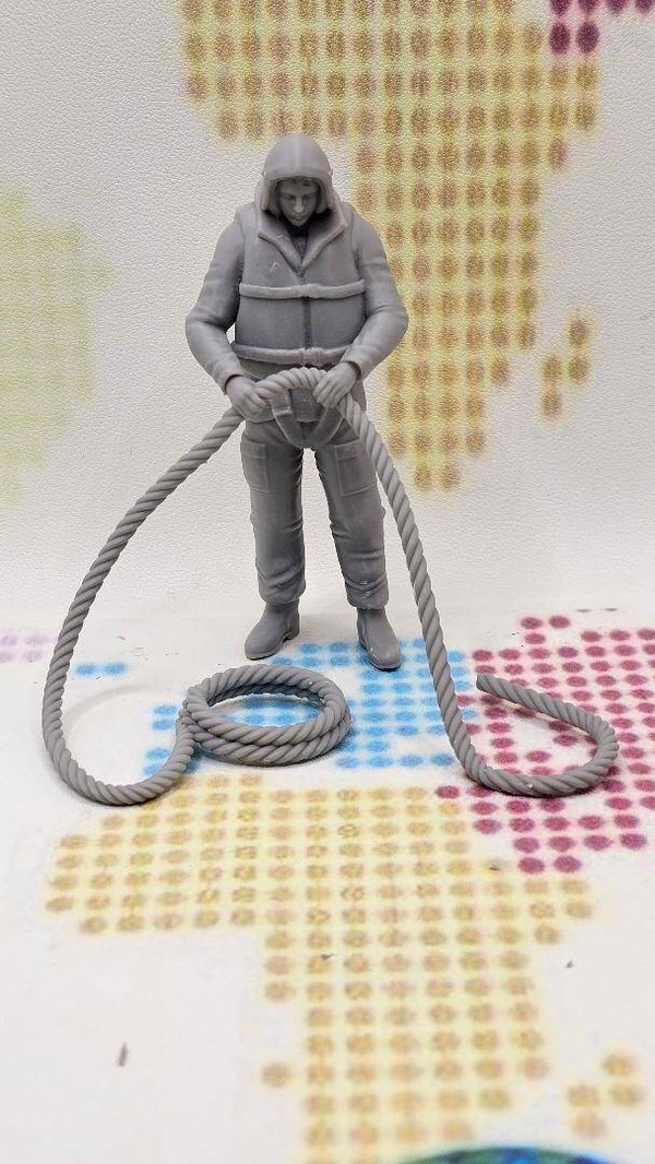 Royal National Lifeboat Institution RNLI Rescue Crew with Rope