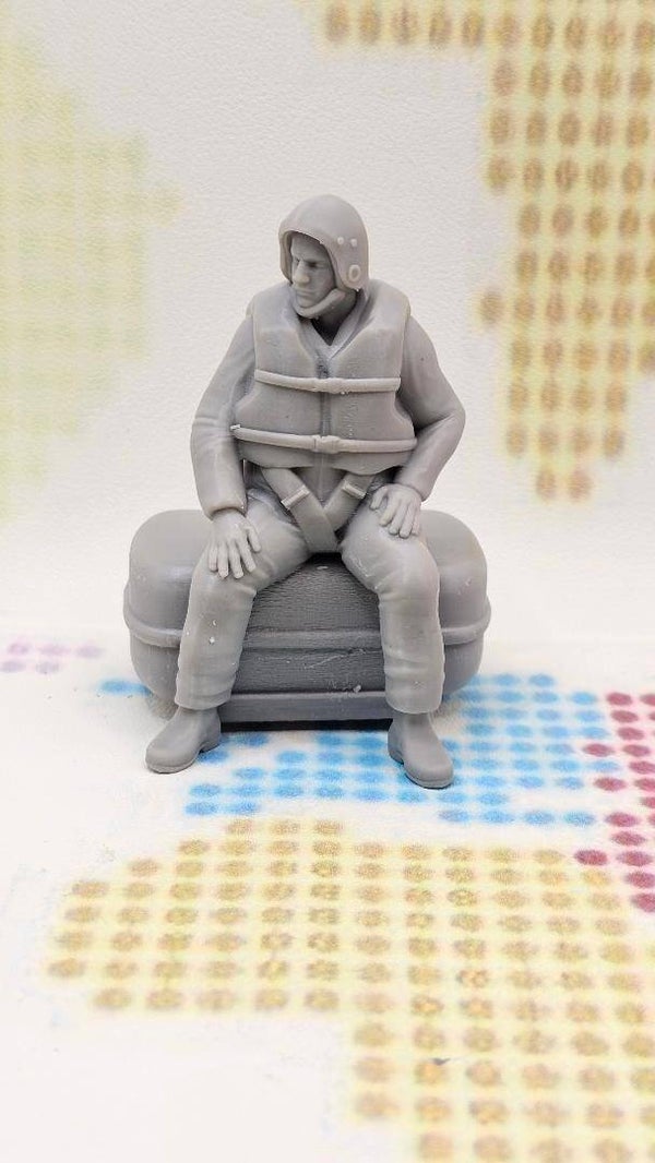 RNLI Rescue Crew Member Sitting on a Box