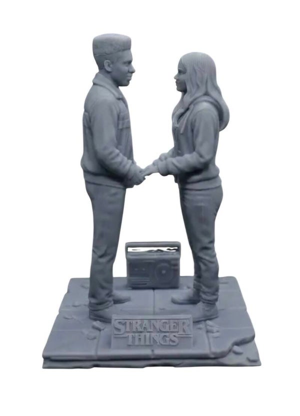 Caleb McLaughlin as Lucas Sinclair & Sadie Sink as Maxine (on base) in STRANGER THINGS