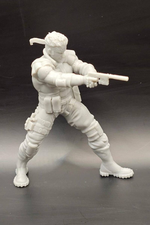 Oscar Isaac as Solid Snake (with gun) in METAL GEAR SOLID