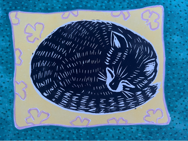 Linoprint slapende kat op kussen