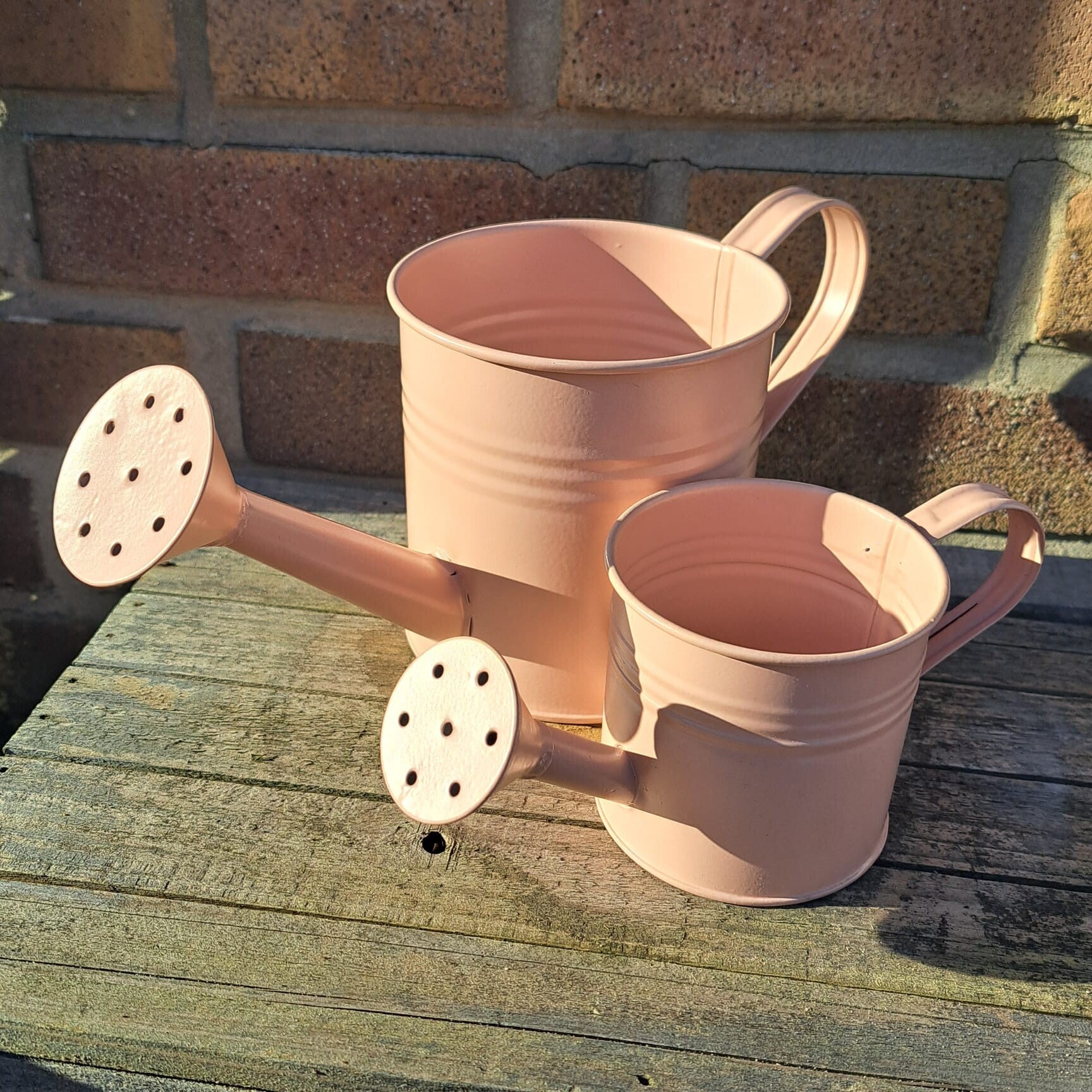 Gieter set klein en groot 7 cm en 11 cm roze