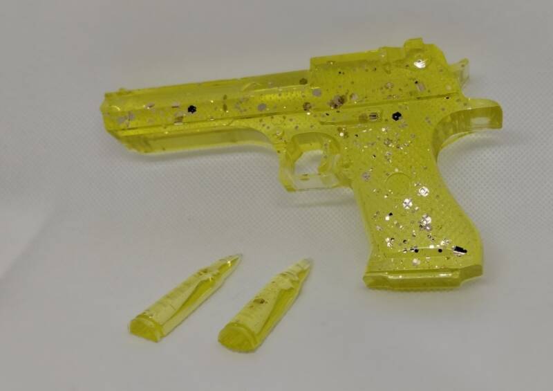 yellow-handgun-with-2-bullets-1-standard.jpg