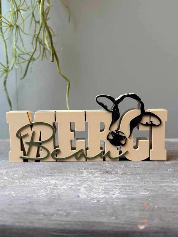 "Merci Beau" koe Word art