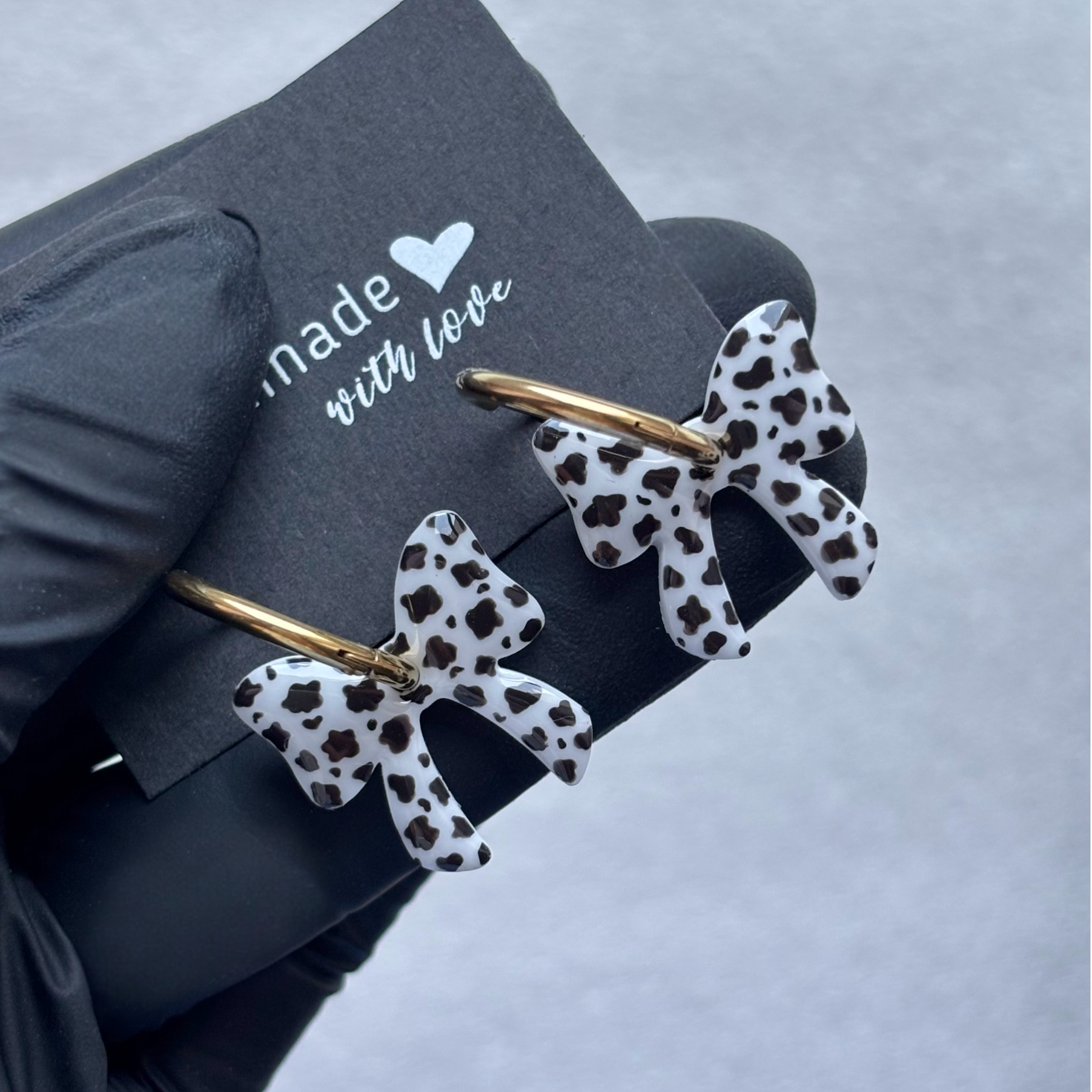 Créoles noeuds interchangeables motif vache (noir)