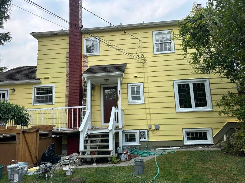 Professional exterior painters in New Westminster BC transforming a residential home
