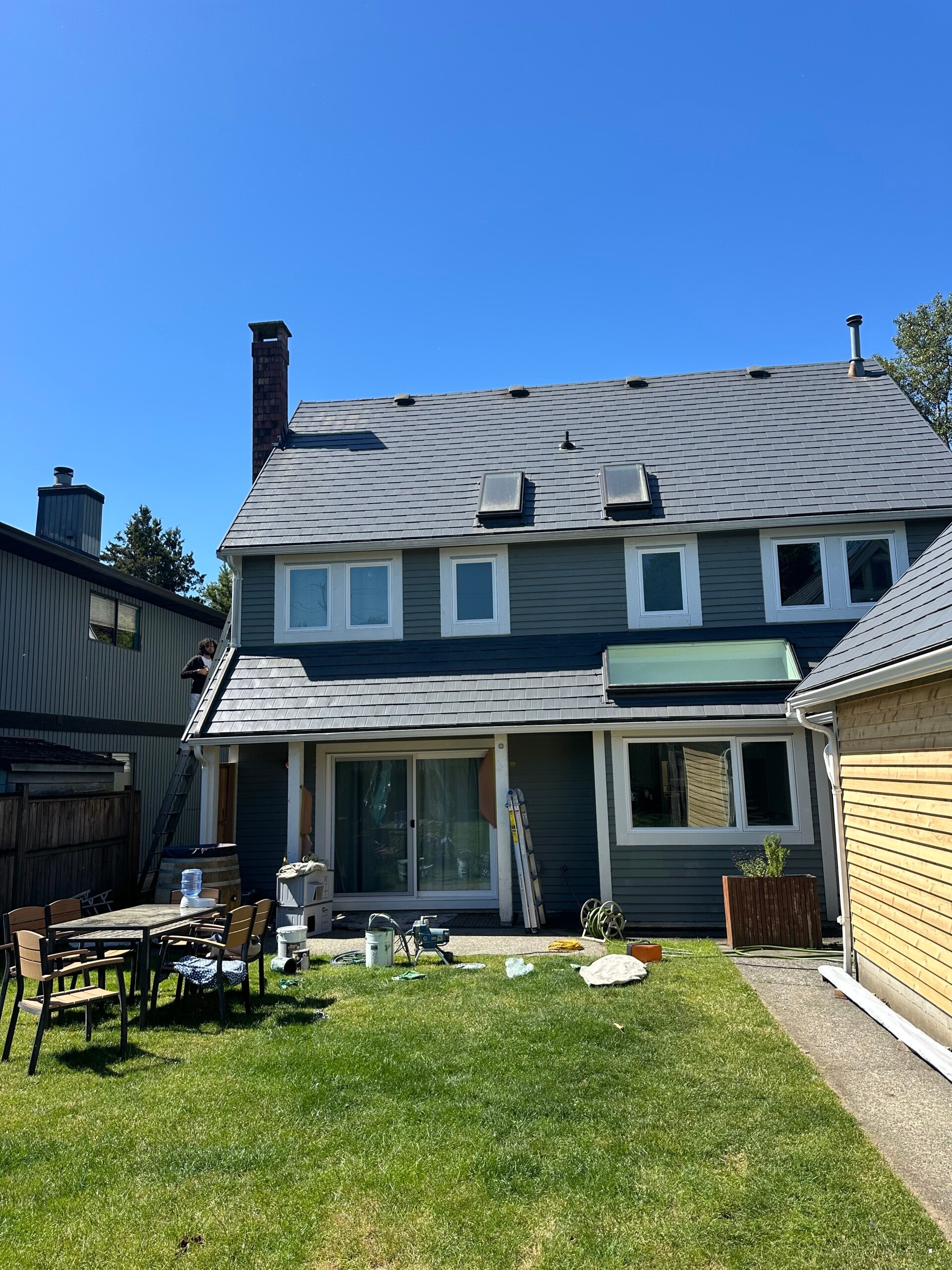 Exterior painter near me preparing and painting a Vancouver residential property